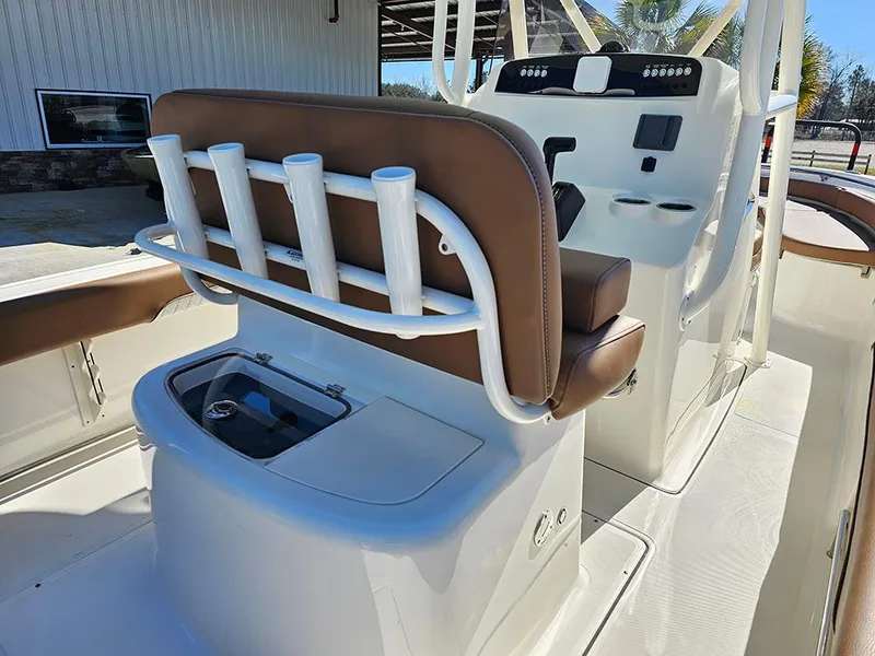 Slide: The Image of 2025 Pioneer 222 Sportfish boat interior with rod holders and seating. - 15