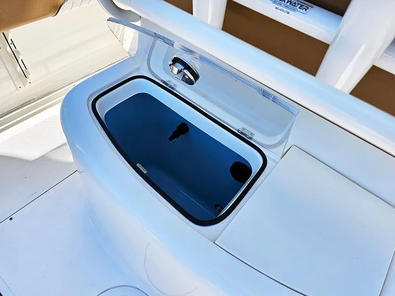Slide: The Image of Open storage compartment on 2025 Pioneer 222 Sportfish boat. - 16