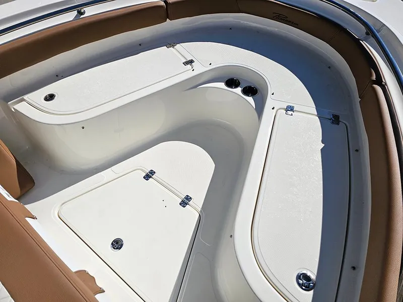 Slide: The Image of 2025 Pioneer 222 Sportfish boat interior with storage compartments and seating. - 24