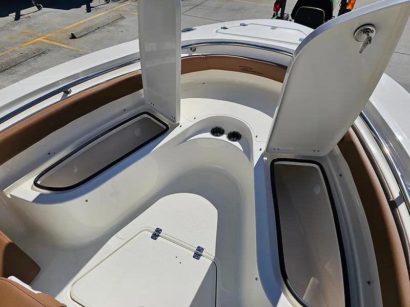 Slide: The Image of 2025 Pioneer 222 Sportfish boat interior with open storage compartments. - 25