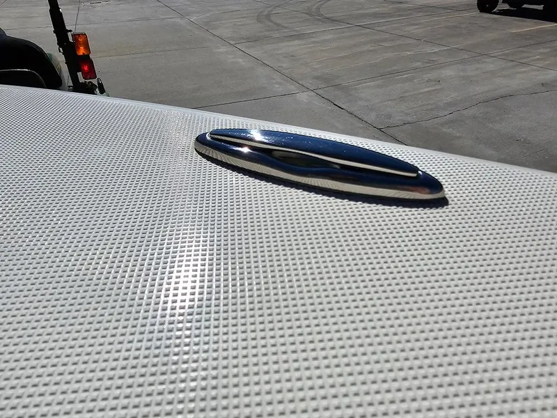 Slide: The Image of Close-up of 2025 Pioneer 222 Sportfish boat deck with textured surface. - 27