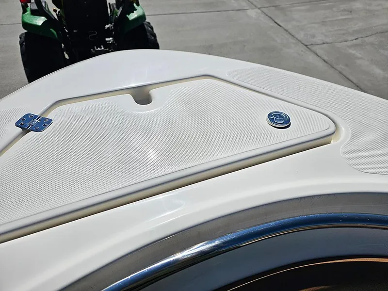 Slide: The Image of 2025 Pioneer 222 Sportfish boat deck detail with textured surface and hardware. - 29