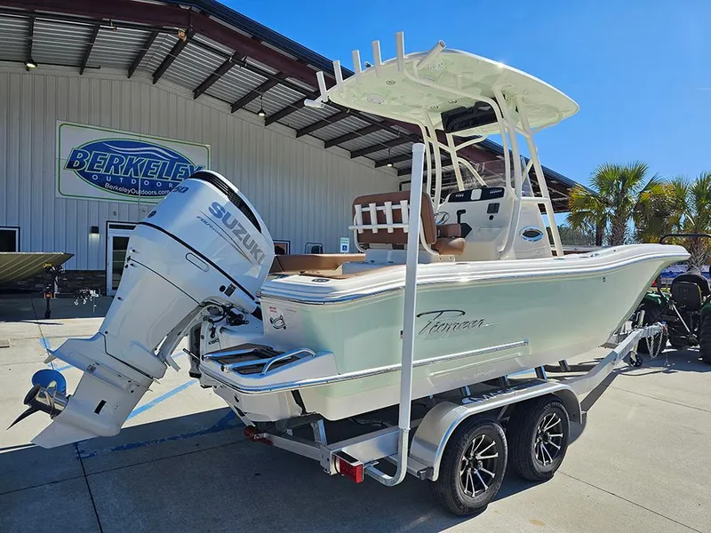 Slide: The Image of 2025 Pioneer 222 Sportfish boat with Suzuki outboard motor on a trailer. - 3