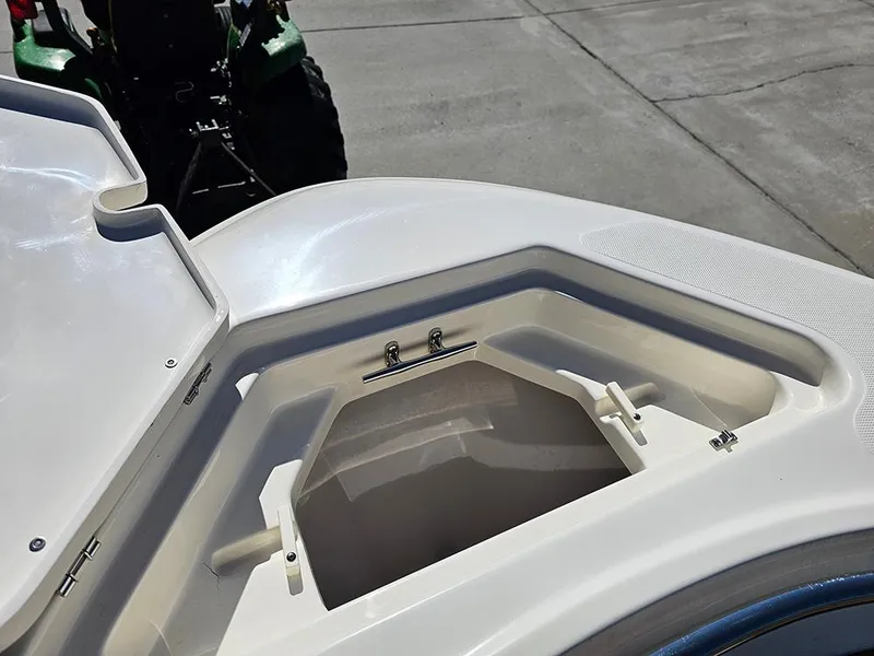 Slide: The Image of 2025 Pioneer 222 Sportfish boat storage compartment open on deck. - 30