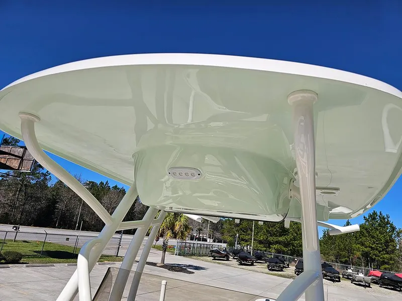Slide: The Image of 2025 Pioneer 222 Sportfish T-top with integrated lighting, viewed from below. - 32