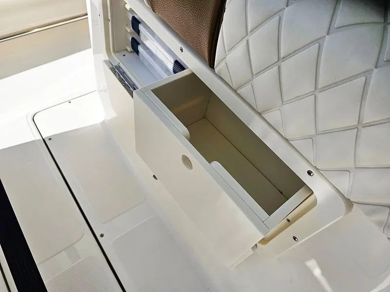 Slide: The Image of Storage compartment on 2025 Pioneer 222 Sportfish boat with quilted seating. - 36