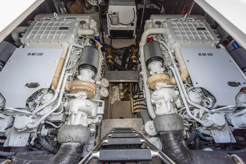 Slide: The Image of Engine room of a 2006 Sea Ray 60 Sundancer yacht, showcasing dual engines. - 34
