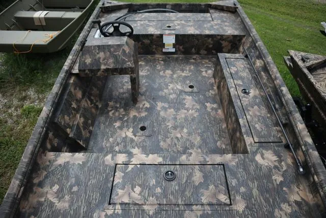 Slide: The Image of 2024 Lowe Roughneck 1660 Add on Console Jet boat with camo interior design. - 6