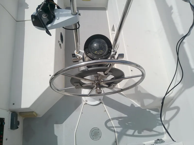 Slide: The Image of Steering wheel and compass of a 1990 Catalina 30 MkII sailboat. - 11