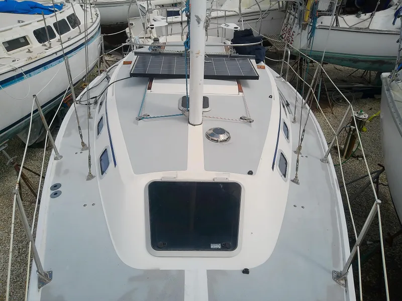 Slide: The Image of Catalina 30 MkII sailboat deck, 1990 model, featuring solar panels and sleek design. - 13