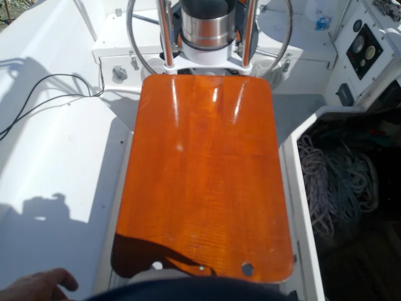 Slide: The Image of Cockpit of 1990 Catalina 30 MkII sailboat with wooden table and steering wheel. - 15