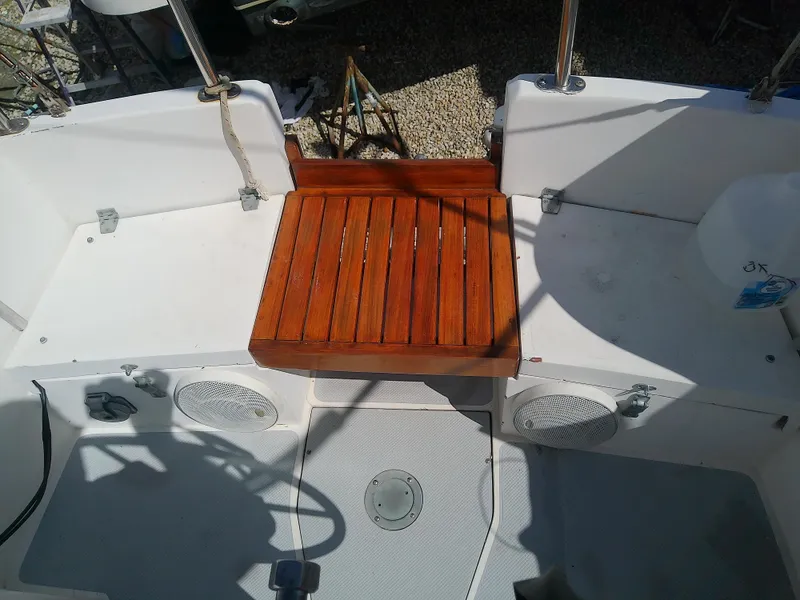 Slide: The Image of Cockpit of 1990 Catalina 30 MkII sailboat with wooden seat and white interior. - 16