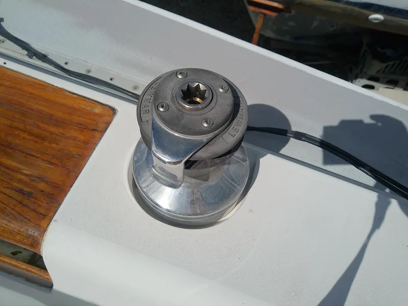 Slide: The Image of Winch on 1990 Catalina 30 MkII sailboat deck, featuring wood trim and metal components. - 20