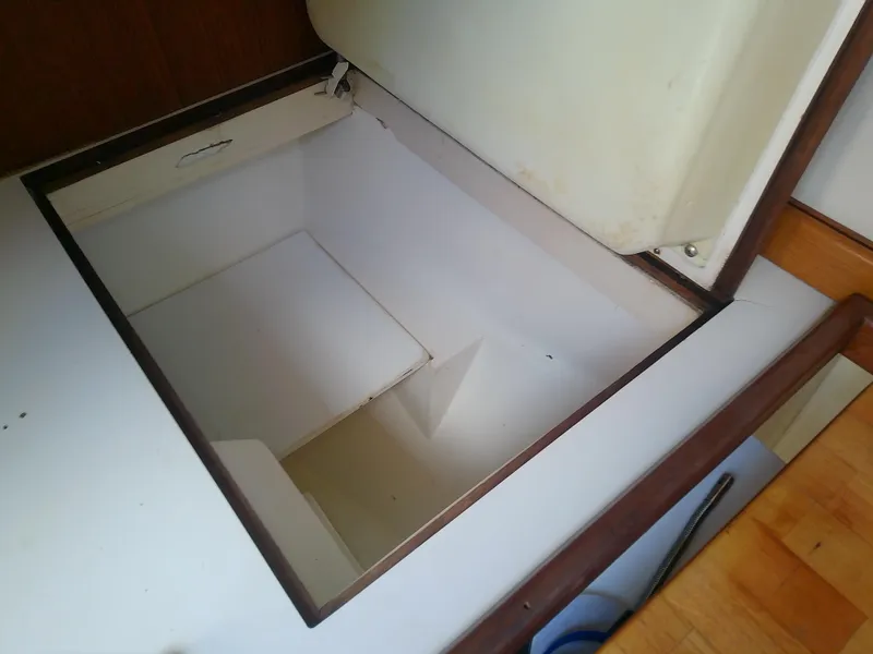 Slide: The Image of Open storage compartment in 1990 Catalina 30 MkII sailboat interior. - 29