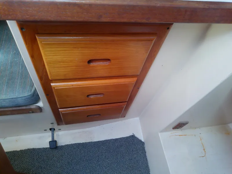 Slide: The Image of Wooden drawers in a 1990 Catalina 30 MkII sailboat interior. - 30