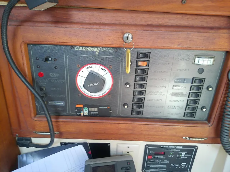 Slide: The Image of Control panel of a 1990 Catalina 30 MkII sailboat with switches and dials. - 34