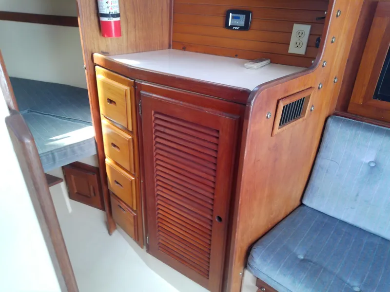 Slide: The Image of Interior of 1990 Catalina 30 MkII sailboat with wooden cabinetry and seating. - 40
