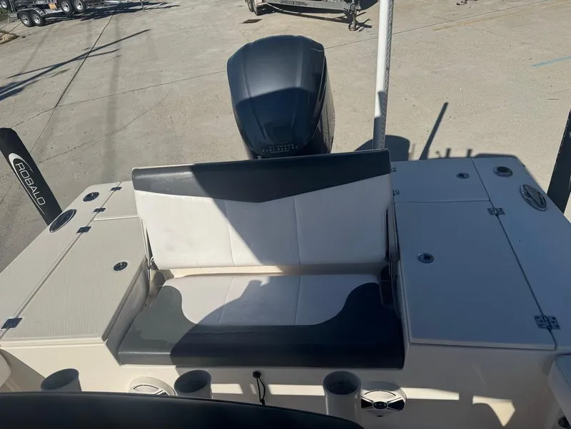Slide: The Image of 2018 Robalo 246 Cayman boat interior with seating and engine view. - 11