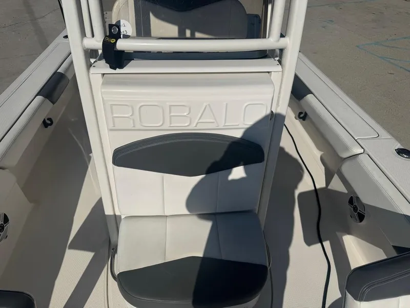 Slide: The Image of 2018 Robalo 246 Cayman boat interior with seating and console. - 16