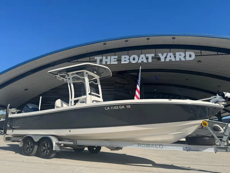 Slide: The Image of 2018 Robalo 246 Cayman boat on trailer at The Boat Yard dealership. - 5