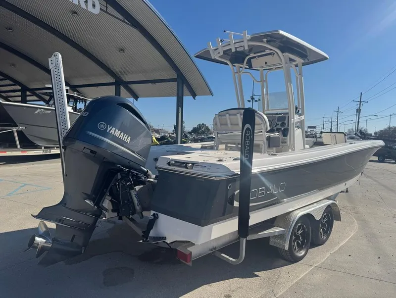 Slide: The Image of 2018 Robalo 246 Cayman boat with Yamaha engine on trailer at dealership. - 6