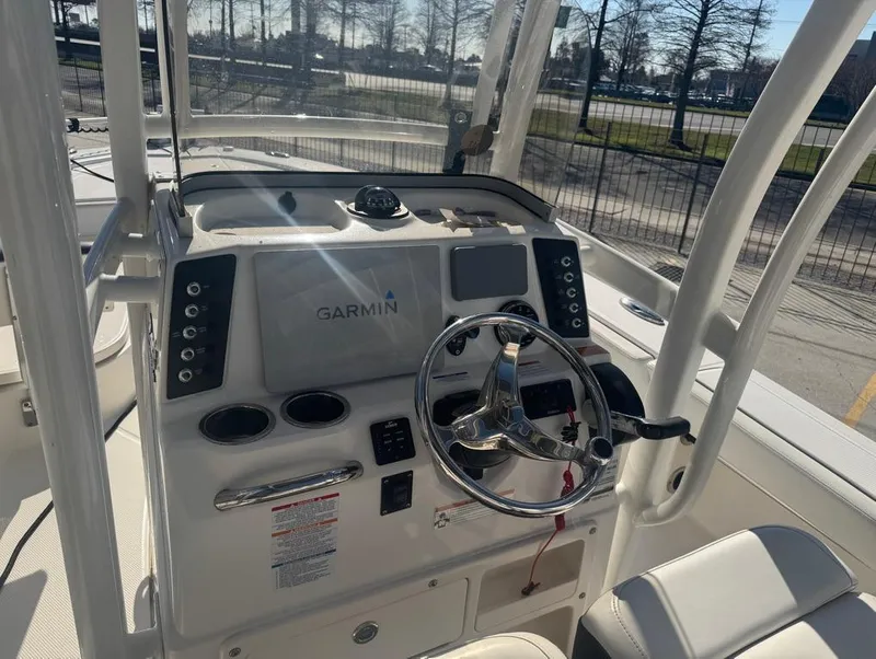 Slide: The Image of 2018 Robalo 246 Cayman boat dashboard with Garmin navigation system. - 9