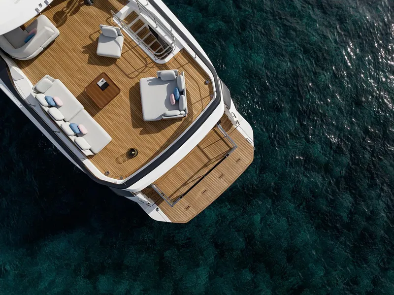Slide: The Image of Luxury Azimut Grande 26M yacht deck, 2025 model, over clear blue water. - 13