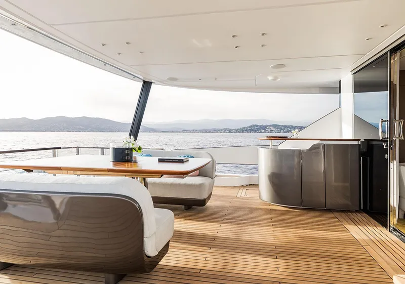 Slide: The Image of Luxurious 2025 Azimut Grande 26M yacht deck with elegant seating and scenic ocean view. - 17