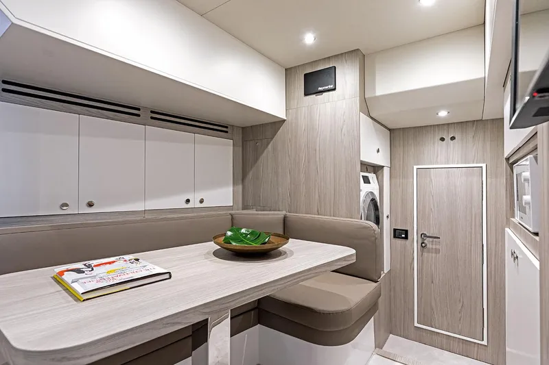 Slide: The Image of Luxurious interior of 2025 Azimut Grande 26M yacht with modern seating and cabinetry. - 32