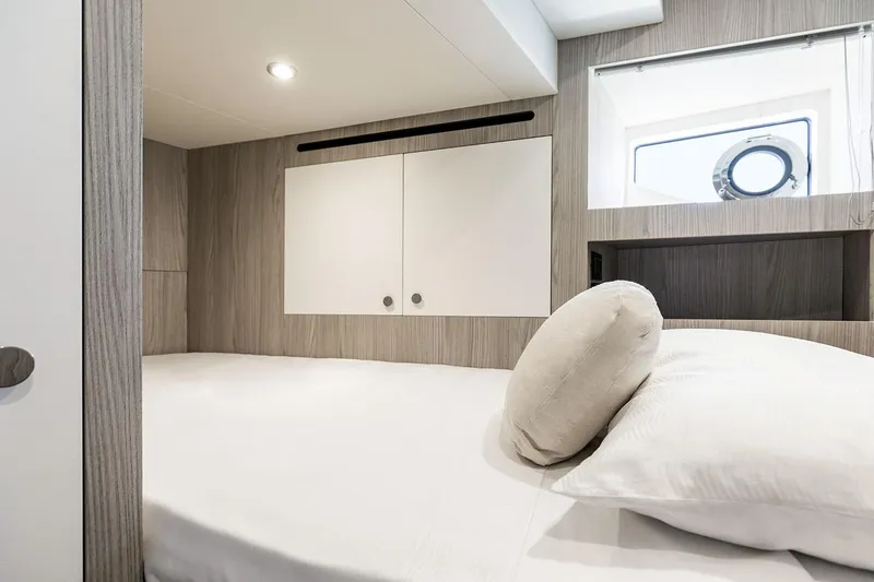 Slide: The Image of Luxurious bedroom interior of 2025 Azimut Grande 26M yacht, featuring modern design and cozy bedding. - 33