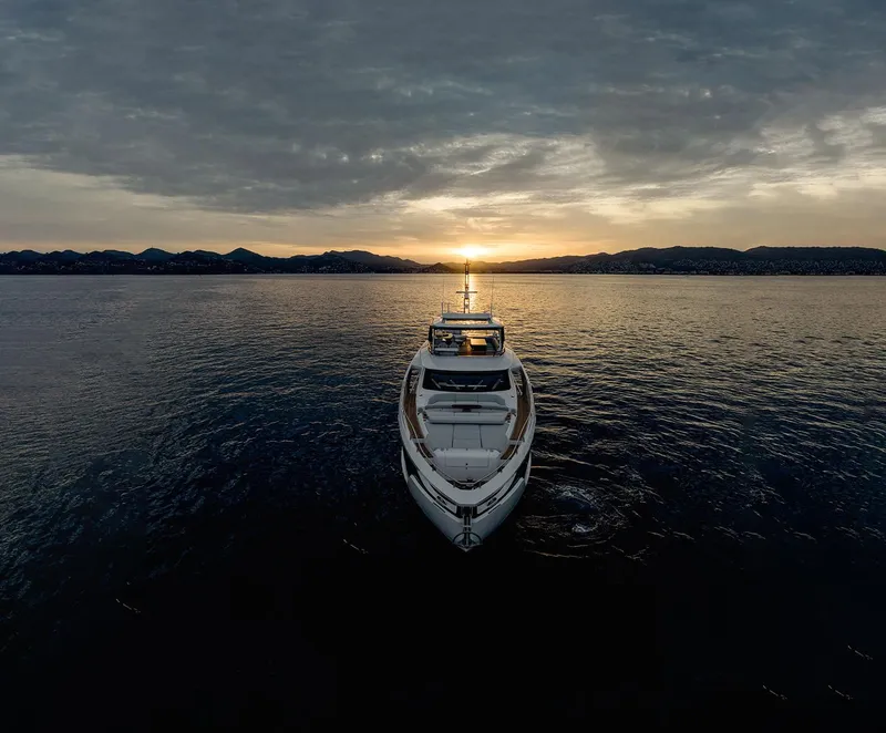 Slide: The Image of Azimut Grande 26M yacht at sunset on calm waters, 2025 model. - 36