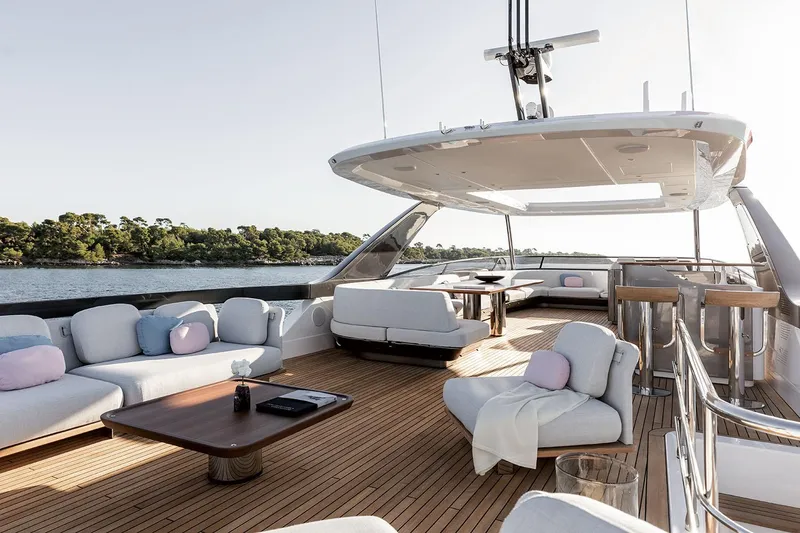 Slide: The Image of Luxurious 2025 Azimut Grande 26M yacht deck with elegant seating and scenic water view. - 38
