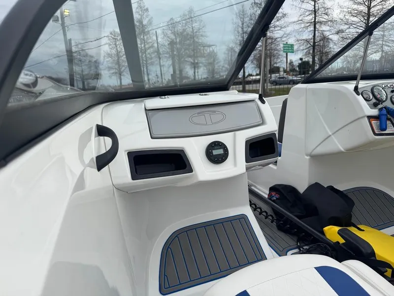 Slide: The Image of 2022 Tahoe 185 S boat interior with dashboard and seating. - 11