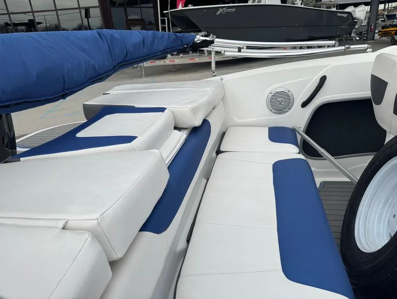 Slide: The Image of 2022 Tahoe 185 S boat interior with blue and white seating, showcasing modern design. - 13