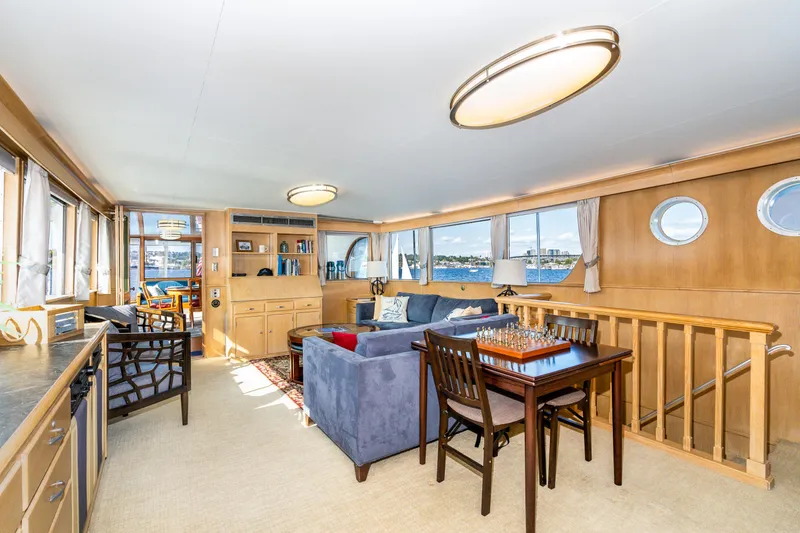 Slide: The Image of Luxurious 1965 Burger Motoryacht interior with elegant seating, dining area, and panoramic windows. - 28