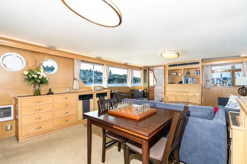 Slide: The Image of Luxurious 1965 Burger Motoryacht interior with elegant wood furnishings and chess set. - 29