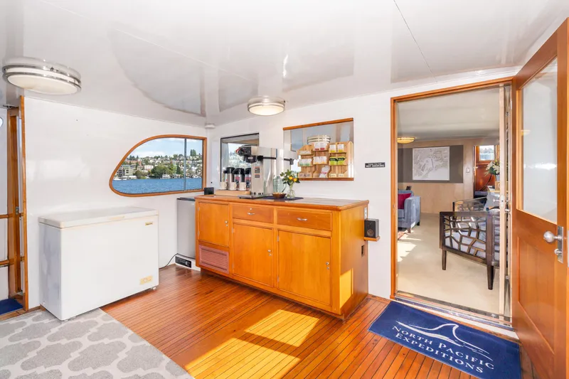 Slide: The Image of Luxurious 1965 Burger Motoryacht interior with wooden flooring and elegant furnishings. - 38