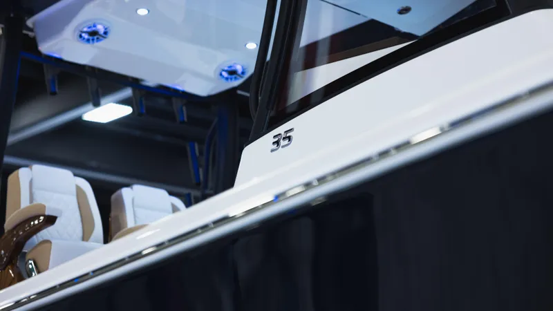 Slide: The Image of 2025 Regulator 35 boat interior with modern seating and sleek design. - 13