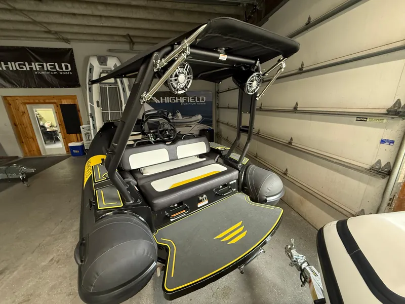 Slide: The Image of 2025 Highfield Velox 420 boat in garage, featuring sleek design and modern equipment. - 5