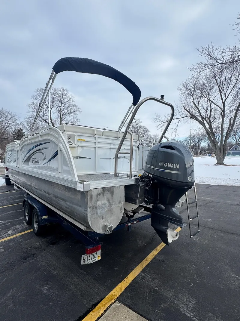 Slide: The Image of 2022 JC Neptoon 25TT pontoon boat with Yamaha motor in snowy parking lot. - 1