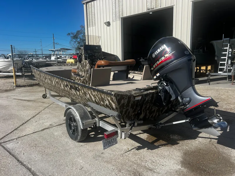Slide: The Image of 2023 Avid 20 Rogue boat with Yamaha outboard motor on a trailer. - 8