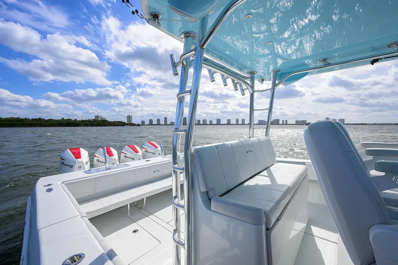 Slide: The Image of 2022 Contender 44FA boat on water, featuring sleek design and powerful engines. - 14