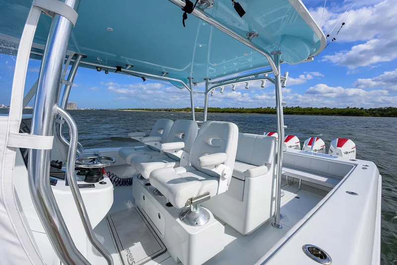 Slide: The Image of 2022 Contender 44FA boat with sleek seating and modern design on open water. - 16