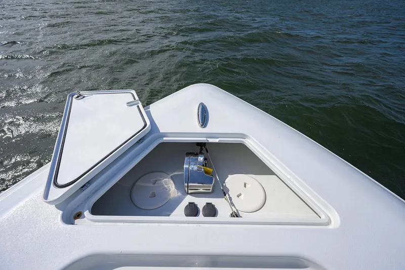 Slide: The Image of Bow of 2022 Contender 44FA boat with open hatch, on water. - 20