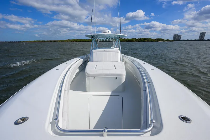 Slide: The Image of 2022 Contender 44FA boat on open water under blue sky. - 21