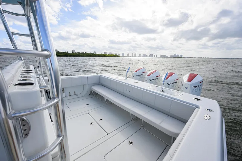 Slide: The Image of 2022 Contender 44FA boat with multiple outboard engines on open water. - 24