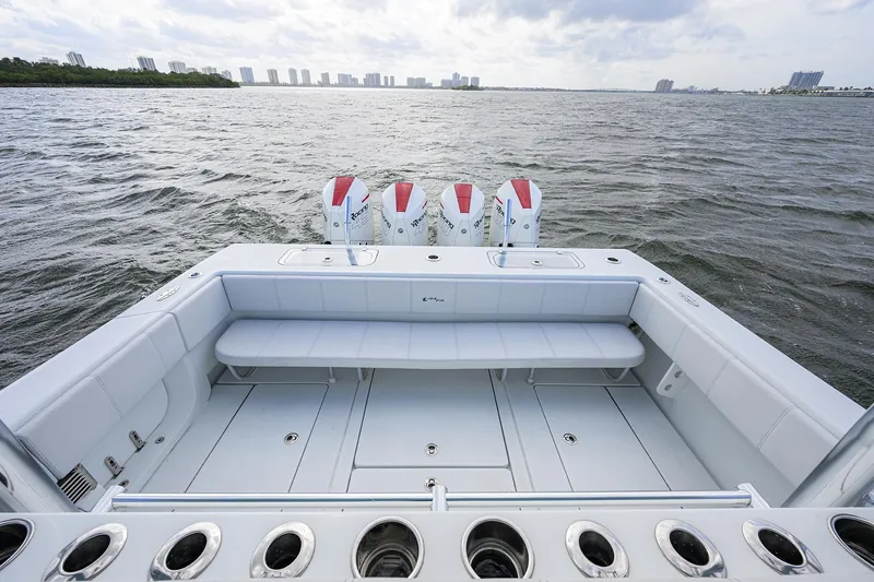 Slide: The Image of 2022 Contender 44FA boat with triple engines on open water. - 25