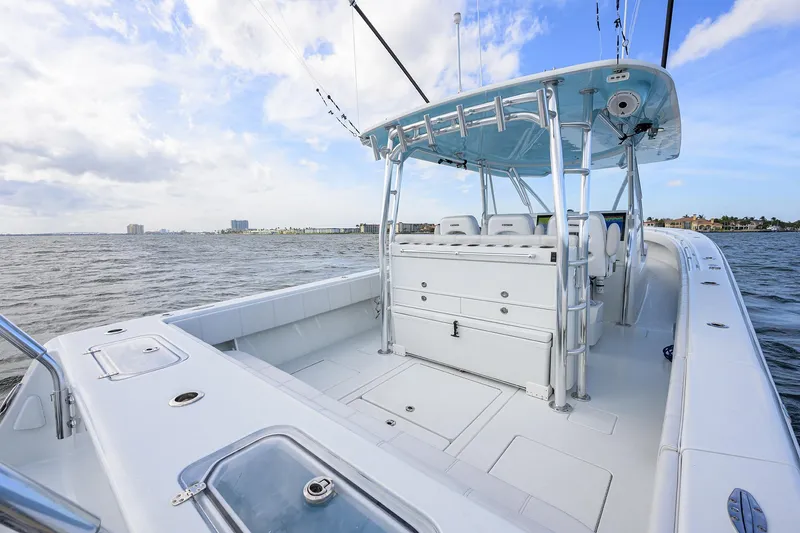 Slide: The Image of 2022 Contender 44FA boat on open water, featuring spacious deck and modern design. - 29