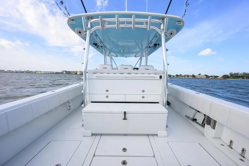 Slide: The Image of 2022 Contender 44FA boat interior with seating, ocean view, and clear sky. - 30