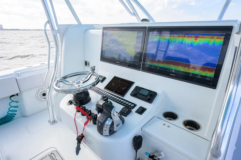Slide: The Image of Helm of 2022 Contender 44FA boat with advanced navigation displays. - 9